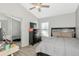 Bedroom with wood laminate floors, vaulted ceilings, ceiling fan and dresser set at 2021 Central Ave, Sarasota, FL 34234