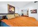 Spacious bedroom with a large bed, sliding mirror closet doors and neutral decor at 2021 Central Ave, Sarasota, FL 34234