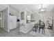 Bright dining area with a stylish table set and an adjacent kitchen area at 2021 Central Ave, Sarasota, FL 34234
