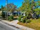 Charming single-story home with a walkway and lush landscaping at 2021 Central Ave, Sarasota, FL 34234