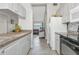 Open kitchen with a view to living room with lots of counter space and stainless appliances at 2021 Central Ave, Sarasota, FL 34234