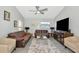 Bright living room showcasing hardwood floors, comfortable seating, and plenty of natural light through large windows at 2021 Central Ave, Sarasota, FL 34234