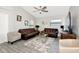 Cozy living room featuring hardwood floors, comfortable sofas, and ample natural light from the windows at 2021 Central Ave, Sarasota, FL 34234