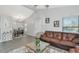 Bright, open-concept living area with hardwood flooring and access to the dining area, creating an inviting atmosphere at 2021 Central Ave, Sarasota, FL 34234