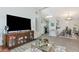 Open-concept living room with hardwood floors flowing seamlessly into the dining and kitchen areas at 2021 Central Ave, Sarasota, FL 34234
