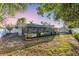 A well-maintained backyard and screened-in porch at 2207 Holyoke Ave, Bradenton, FL 34207