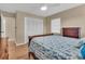 Bright bedroom with hardwood floors, a ceiling fan, a window, and a closet at 2207 Holyoke Ave, Bradenton, FL 34207