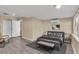 Cozy staged bedroom features vinyl plank flooring, a plush bed, and minimalist decor at 2207 Holyoke Ave, Bradenton, FL 34207