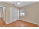 Empty bedroom with hardwood floors, a ceiling fan, a window, and a closet at 2207 Holyoke Ave, Bradenton, FL 34207