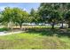 Lush community park with ample seating surrounded by mature trees, perfect for relaxation and outdoor enjoyment at 2207 Holyoke Ave, Bradenton, FL 34207