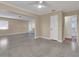 Open-concept living room with neutral paint, durable flooring, and ample natural light flowing into adjacent rooms at 2207 Holyoke Ave, Bradenton, FL 34207