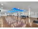 Spacious meeting room with hardwood floors and stylish lighting, ideal for community gatherings at 2207 Holyoke Ave, Bradenton, FL 34207