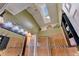 Well-lit bathroom with a skylight, glass shower, and decorative backsplash at 2409 Gun Flint Trl, Palm Harbor, FL 34683