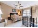Upstairs bedroom with vaulted ceiling, natural light, and nearby access to a staircase at 2409 Gun Flint Trl, Palm Harbor, FL 34683