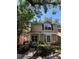 Charming two-story home featuring a covered porch and well-maintained landscaping at 2409 Gun Flint Trl, Palm Harbor, FL 34683