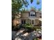 Inviting two-story townhouse with lush greenery and a charming front entrance at 2409 Gun Flint Trl, Palm Harbor, FL 34683