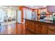 This kitchen has granite countertops and wood cabinets with stainless steel appliances at 2409 Gun Flint Trl, Palm Harbor, FL 34683