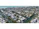 Stunning aerial view showcases a home near white sand beaches and winding canals, offering waterfront living and coastal charm at 244 Willow Ave, Anna Maria, FL 34216
