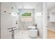 Luxurious bathroom showcasing a soaking tub, glass shower, and modern fixtures at 244 Willow Ave, Anna Maria, FL 34216