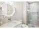 Modern bathroom featuring a glass-enclosed shower and sleek vanity at 244 Willow Ave, Anna Maria, FL 34216