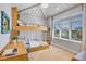 Charming bedroom featuring built-in bunk beds and a study desk with a vaulted ceiling at 244 Willow Ave, Anna Maria, FL 34216