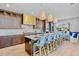 Spacious kitchen with center island, breakfast bar seating, and modern appliances at 244 Willow Ave, Anna Maria, FL 34216