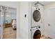 Modern laundry area with stacked washer/dryer near a bedroom at 244 Willow Ave, Anna Maria, FL 34216