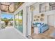 Stunning living room with high ceilings, water view and access to large outdoor balcony at 244 Willow Ave, Anna Maria, FL 34216