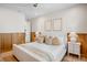 Comfortable primary bedroom with elegant decor, bedside tables, and stylish lamps at 244 Willow Ave, Anna Maria, FL 34216