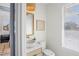 Stylish powder room with modern fixtures, designer mirror, and soft, neutral tones at 244 Willow Ave, Anna Maria, FL 34216