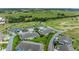Expansive aerial view of homes and a golf course community with lush green fairways at 3009 Live Oak Ln # 33, Palmetto, FL 34221