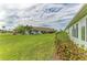 Spacious backyard with lush green lawn, mature landscaping, and a tranquil setting at 3009 Live Oak Ln # 33, Palmetto, FL 34221