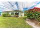 Well-maintained backyard with mature landscaping, providing privacy and shade at 3009 Live Oak Ln # 33, Palmetto, FL 34221