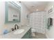 Bathroom featuring a vanity sink with granite countertop and tub shower with curtain at 3009 Live Oak Ln # 33, Palmetto, FL 34221