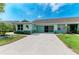 Well-maintained single-story home featuring an attached two-car garage and neatly kept landscaping at 3009 Live Oak Ln # 33, Palmetto, FL 34221