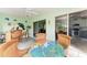 Charming Florida room with access to kitchen, dining area, and beautiful outdoor views at 3009 Live Oak Ln # 33, Palmetto, FL 34221