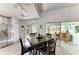Eat-in kitchen featuring a dark wood dining table, tile floors, and stainless steel fridge at 3009 Live Oak Ln # 33, Palmetto, FL 34221