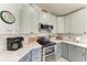 Bright kitchen featuring stainless steel appliances, white countertops, and custom cabinets at 3009 Live Oak Ln # 33, Palmetto, FL 34221