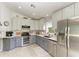 Open kitchen with stainless steel appliances, tile backsplash, and granite countertops at 3009 Live Oak Ln # 33, Palmetto, FL 34221