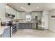 Spacious kitchen featuring stainless steel appliances, granite countertops, and gray cabinets at 3009 Live Oak Ln # 33, Palmetto, FL 34221