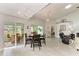 Spacious living room featuring a dining area, tiled floors, and access to the lanai at 3009 Live Oak Ln # 33, Palmetto, FL 34221