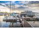 Waterfront view of a restaurant with boats docked along a wooden pier at 3009 Live Oak Ln # 33, Palmetto, FL 34221