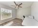 Bright office space with a large window, wood-look flooring, and ample desk space at 3126 58Th E Way, Palmetto, FL 34221