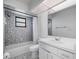 Bathroom featuring mosaic tile walls, a tub with shower, and a vanity with sink at 314 Signorelli Dr, Nokomis, FL 34275