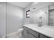 Updated bathroom featuring modern vanity, gray cabinets, and subway tile in the shower at 314 Signorelli Dr, Nokomis, FL 34275