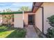 Inviting front entrance with a screened door, landscaping, and a walkway leading to the front door at 314 Signorelli Dr, Nokomis, FL 34275