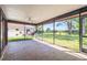 Large screened lanai with tile flooring and ceiling fan, offering a great outdoor living space at 314 Signorelli Dr, Nokomis, FL 34275