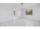 Spacious living area featuring tile flooring, great natural light, and neutral colors at 314 Signorelli Dr, Nokomis, FL 34275