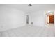 Bright and airy living room with tile floors leading to the front door at 314 Signorelli Dr, Nokomis, FL 34275
