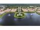 Gorgeous aerial view of community lake, pool and landscaping with multiple fountains on the lake at 3456 Parkridge Cir # 33-105, Sarasota, FL 34243